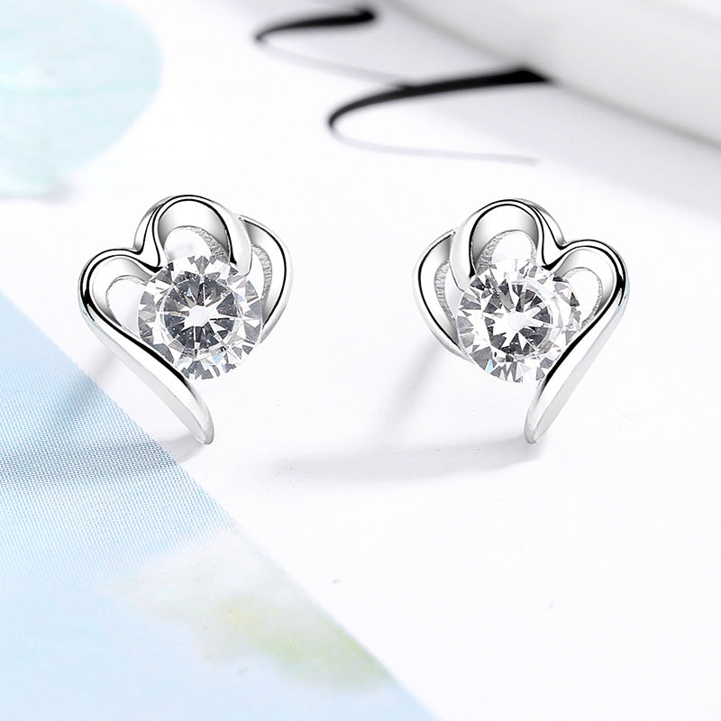 Women’s stud earrings with stylish heart design and sparkling crystals All Fashion