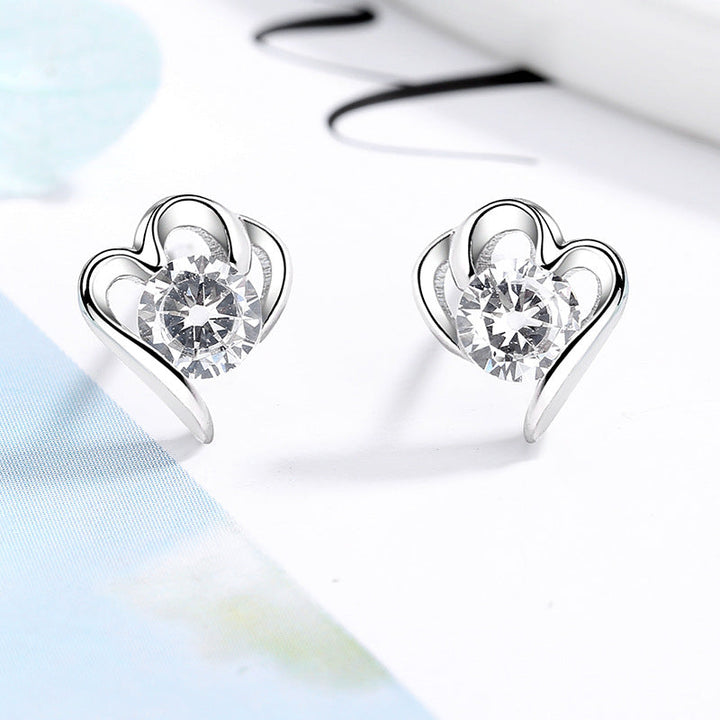 Women’s stud earrings with stylish heart design and sparkling crystals All Fashion