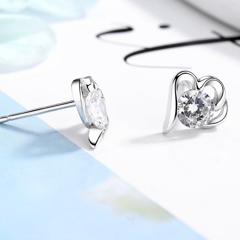 Women’s stud earrings with stylish heart design and sparkling crystals All Fashion