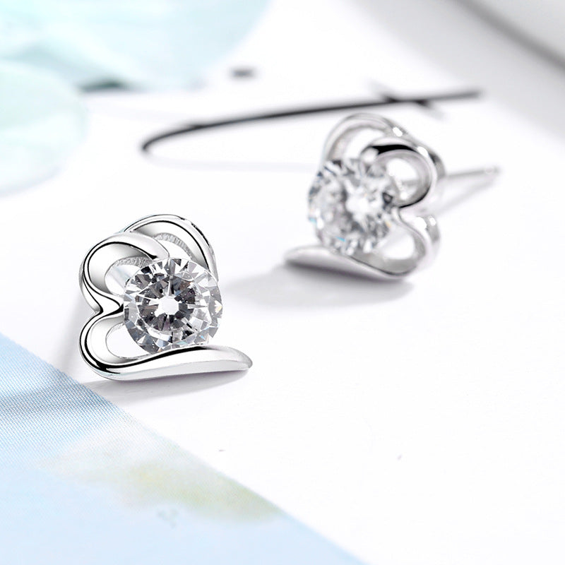 Women’s stud earrings with stylish heart design and sparkling crystals All Fashion