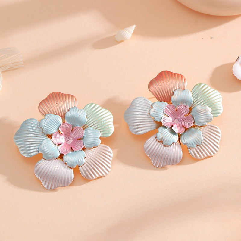 Ladies' flower earrings with intricate design and glossy accents All Fashion