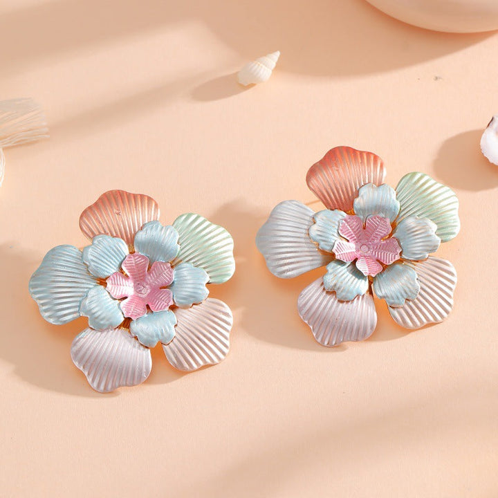 Ladies' flower earrings with intricate design and glossy accents All Fashion