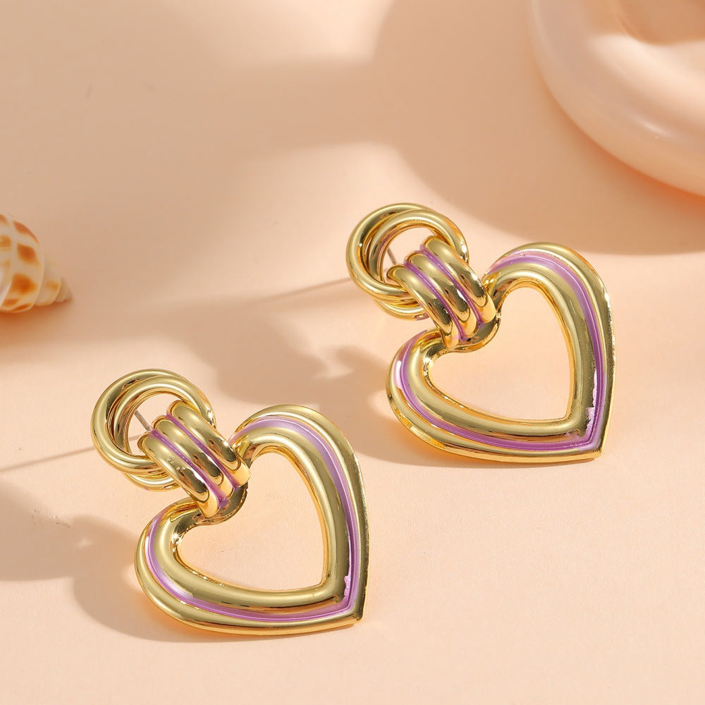 Women’s earrings in modern heart design All Fashion