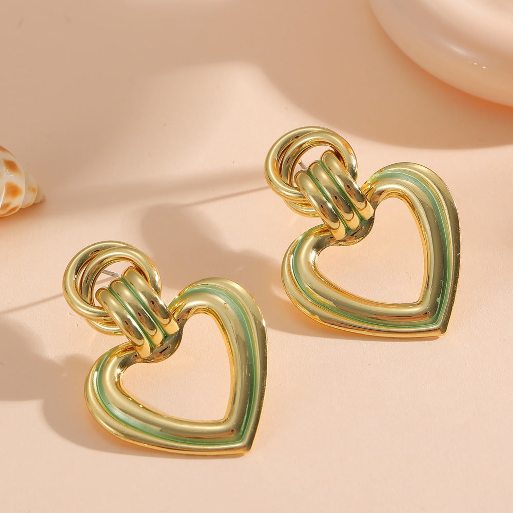 Women’s earrings in modern heart design All Fashion