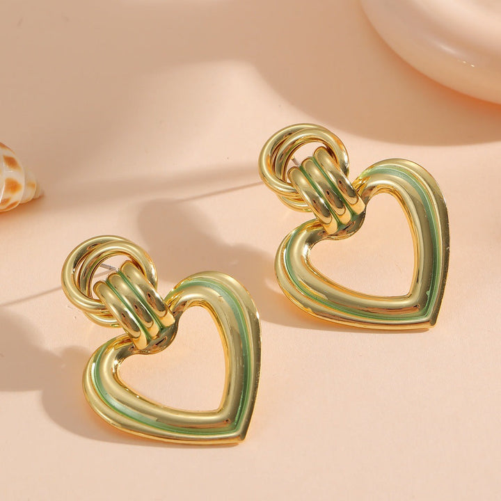 Women’s earrings in modern heart design All Fashion