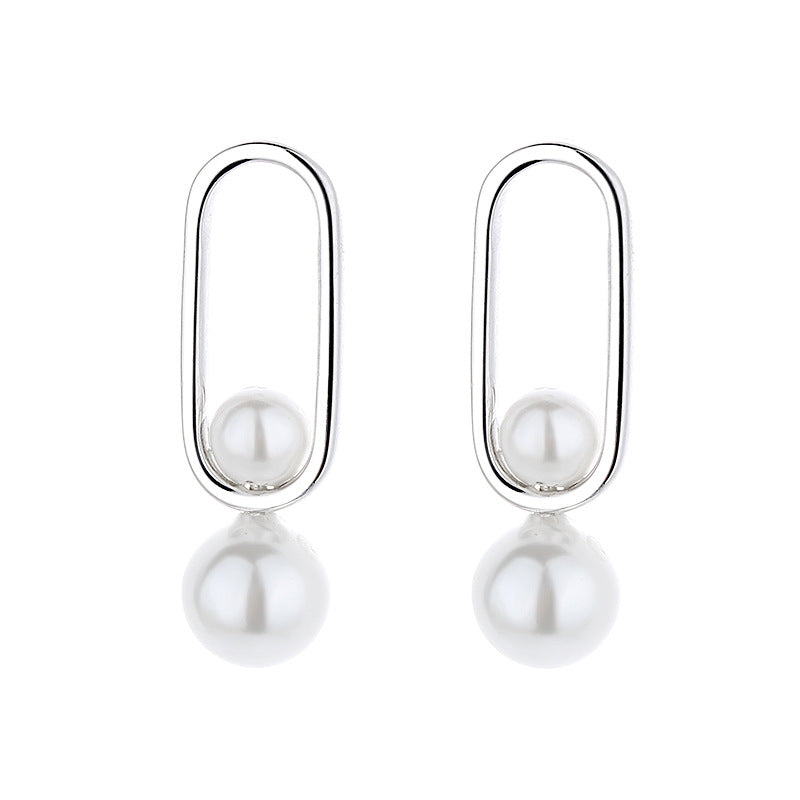 Women's stud earrings with modern oval design and elegant pearls All Fashion