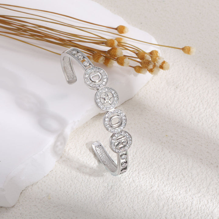 Women's bangle with elegant infinity pattern and sparkling zirconia All Fashion