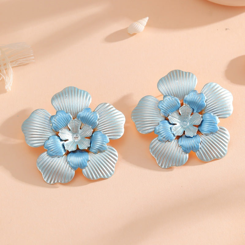 Ladies' flower earrings with intricate design and glossy accents All Fashion