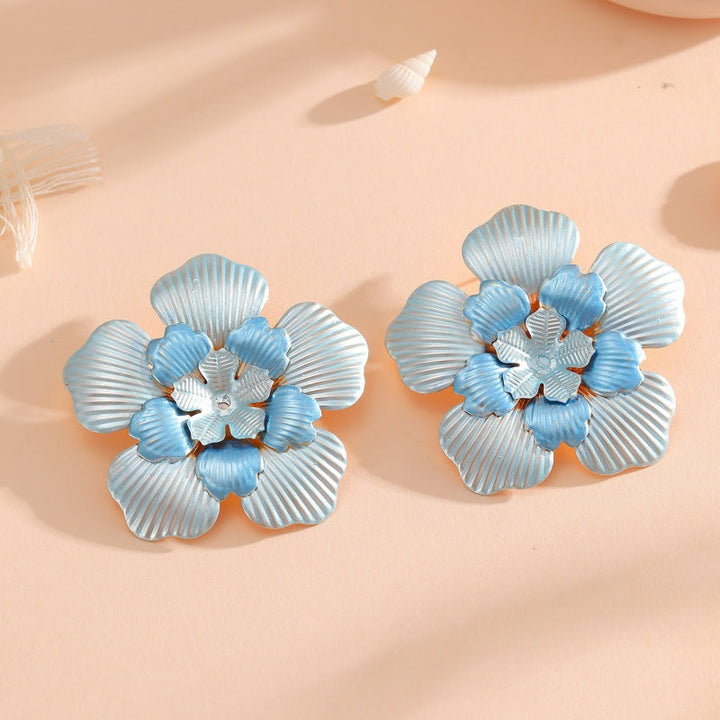 Ladies' flower earrings with intricate design and glossy accents All Fashion