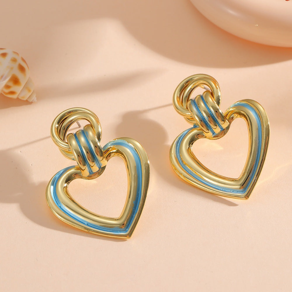 Women’s earrings in modern heart design All Fashion