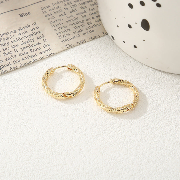 Women's hoop earrings with modern, textured design All Fashion