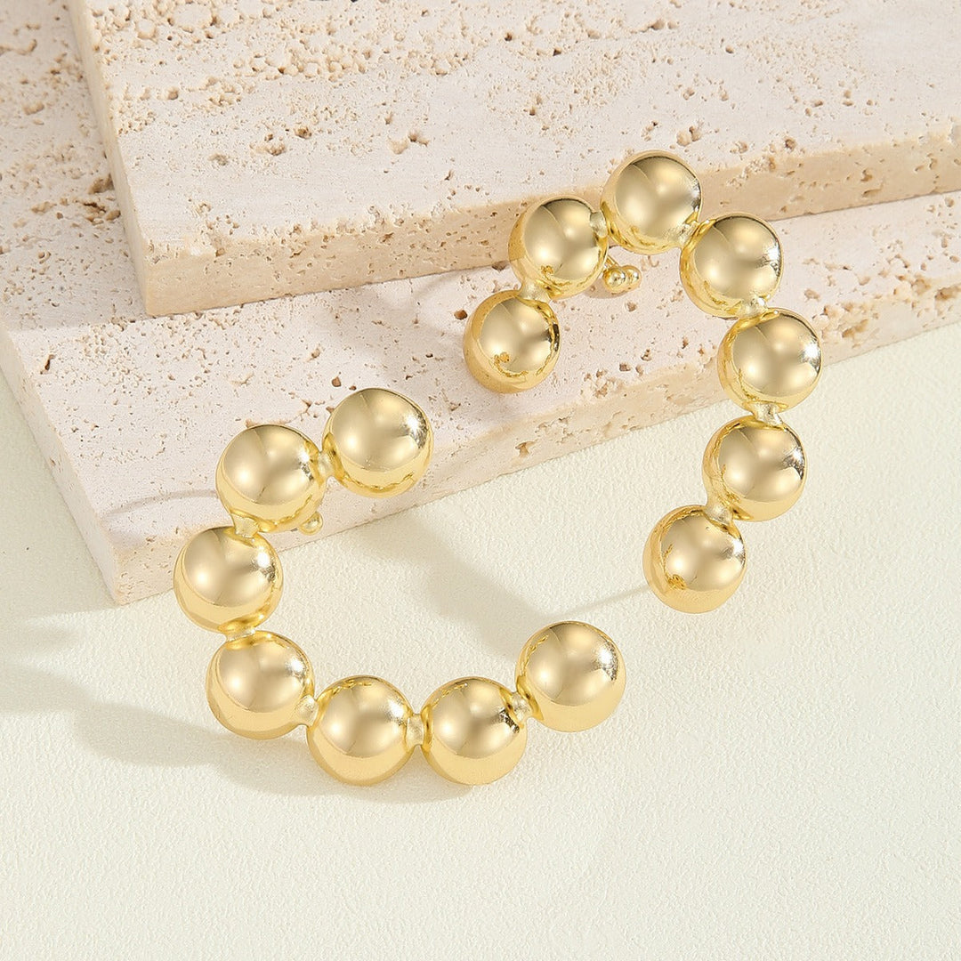 Women's bracelet with structured, golden beads All Fashion