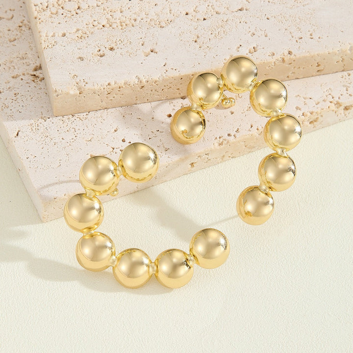 Women's bracelet with structured, golden beads All Fashion
