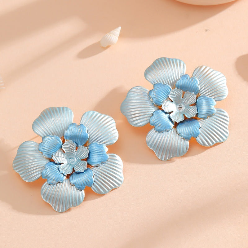 Ladies' flower earrings with intricate design and glossy accents All Fashion
