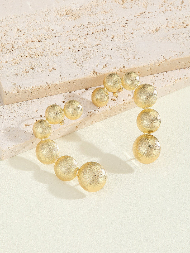 Women's bracelet with structured, golden beads All Fashion