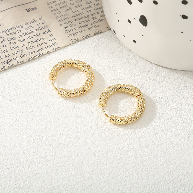 Women's hoop earrings with modern, textured design All Fashion