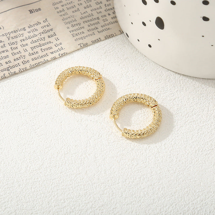 Women's hoop earrings with modern, textured design All Fashion