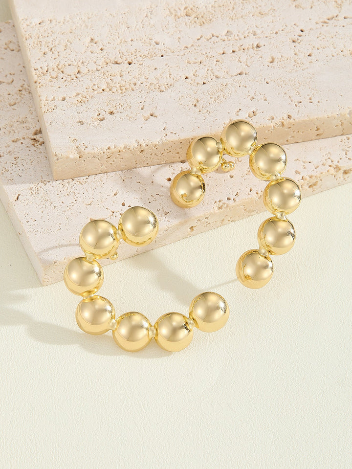 Women's bracelet with structured, golden beads All Fashion