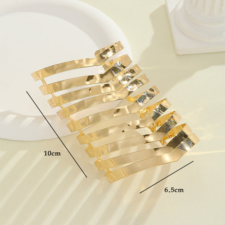 Women's hair accessories with shiny, curved elements All Fashion