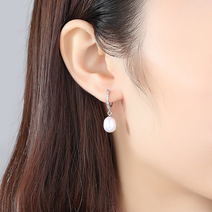 Ladies earrings with elegant zirconia decorations and pearl pendants All Fashion