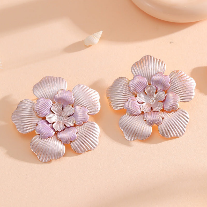 Ladies' flower earrings with intricate design and glossy accents All Fashion