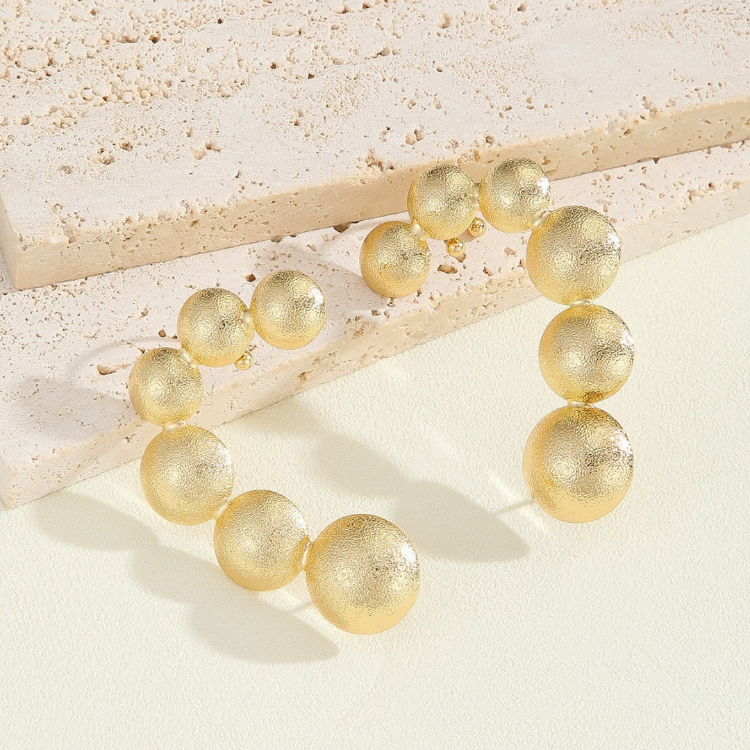 Women's bracelet with structured, golden beads All Fashion