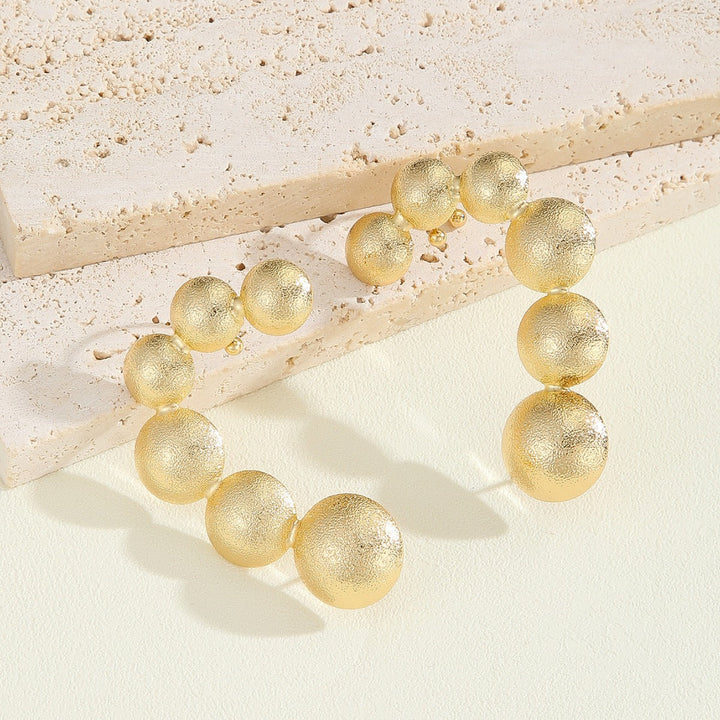 Women's bracelet with structured, golden beads All Fashion