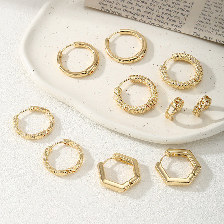 Women's hoop earrings with modern, textured design All Fashion