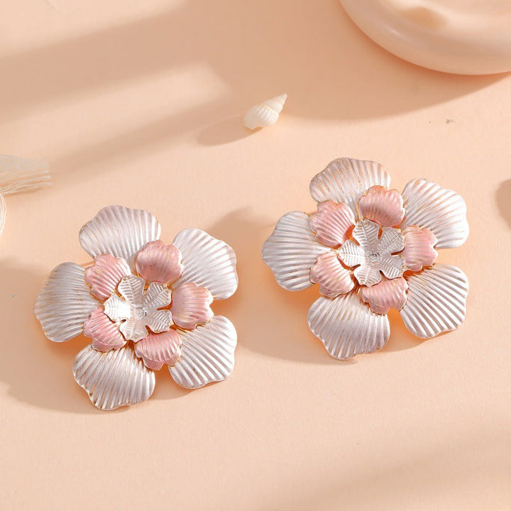 Ladies' flower earrings with intricate design and glossy accents All Fashion