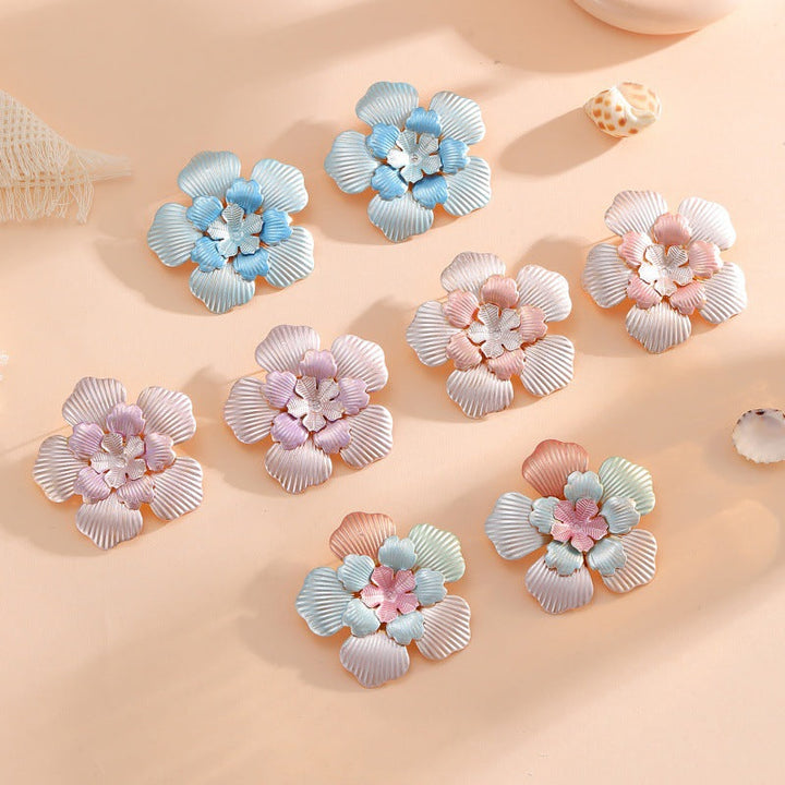 Ladies' flower earrings with intricate design and glossy accents All Fashion