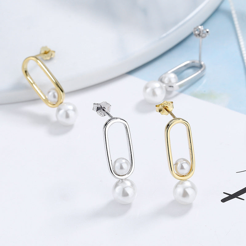 Women's stud earrings with modern oval design and elegant pearls All Fashion