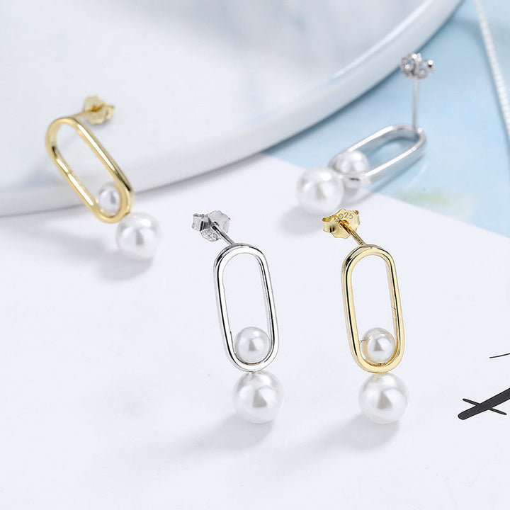 Women's stud earrings with modern oval design and elegant pearls All Fashion