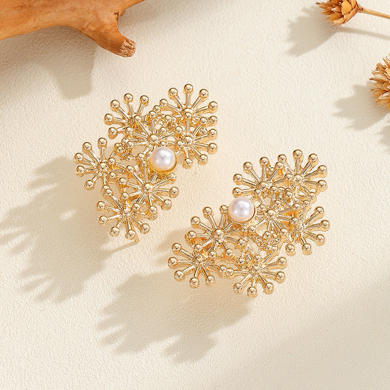 Women’s ear clips with elaborate flower design and pearl accent All Fashion