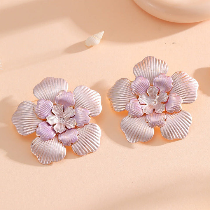 Ladies' flower earrings with intricate design and glossy accents All Fashion